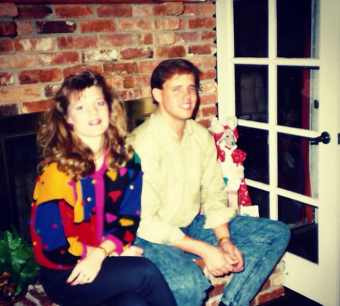 A young Greg and Karen sitting together in the early years